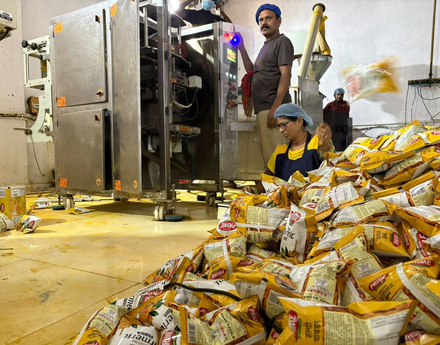 Packing Prime turmeric powder on the filling machine at our unit