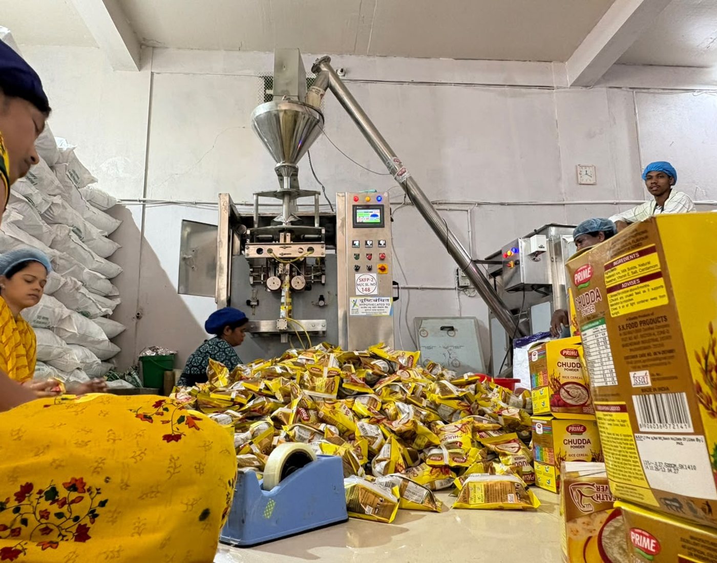 Prime Agro team packing Chudda powder at the auger filling machine
